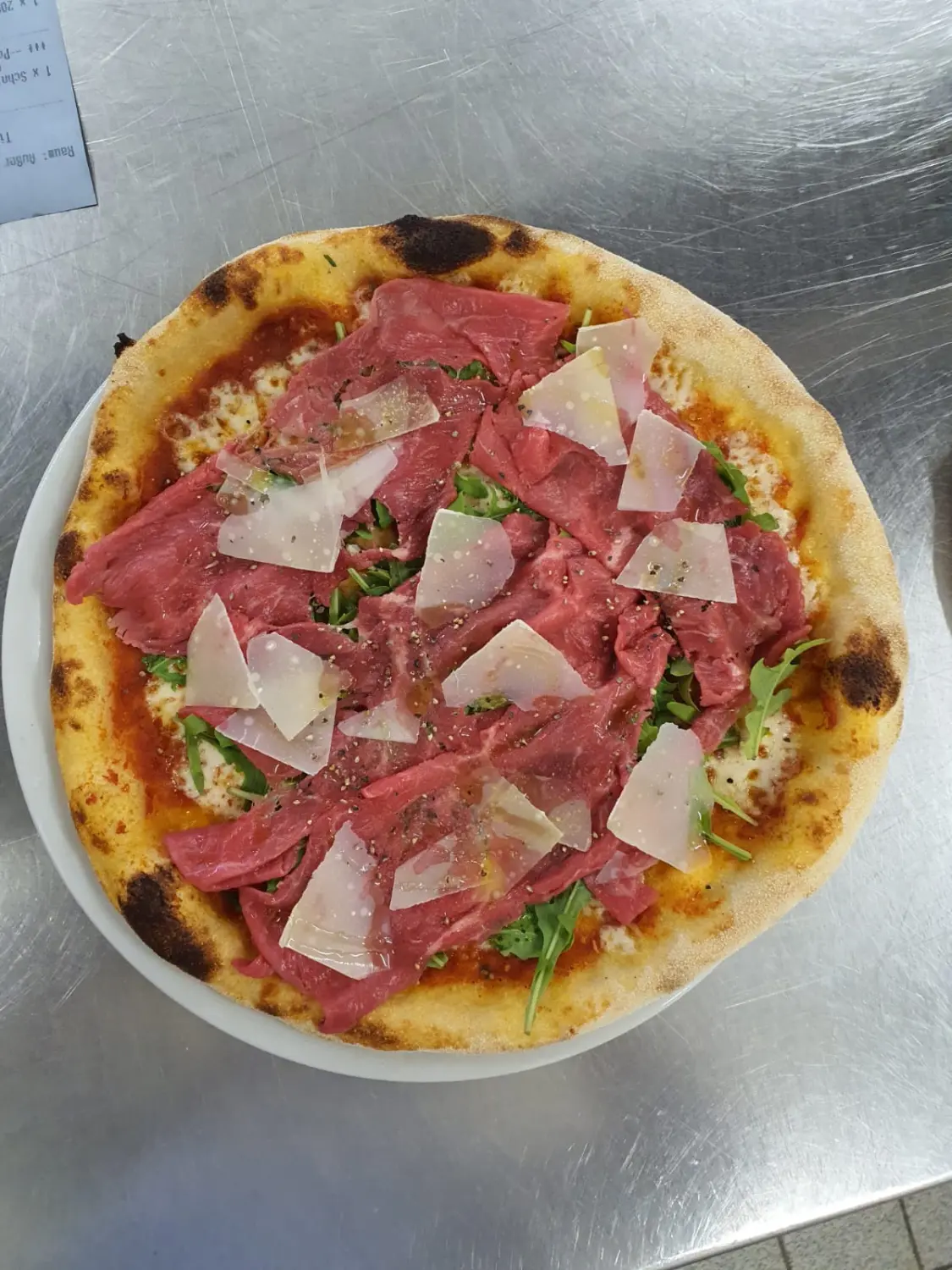 Pizza vom Ristorante Pizzeria Bella Vista